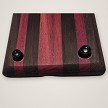 Close-up of the rubber feet on the underside of the walnut and purpleheart tray 