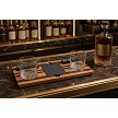 Walnut and cherry whiskey tray with glasses and whiskey stones on a home bar 