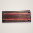 Bottom of the walnut, purpleheart and zebrawood whiskey tray showing four non-slip rubber feet 